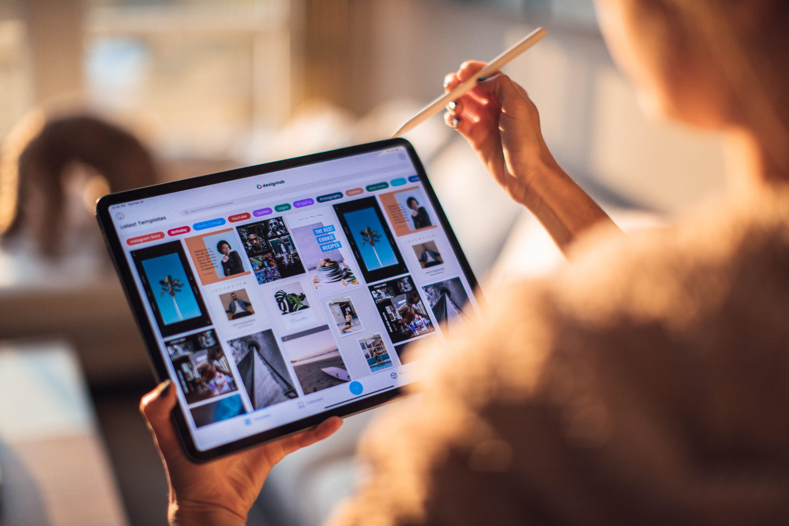 woman using a tablet and pen